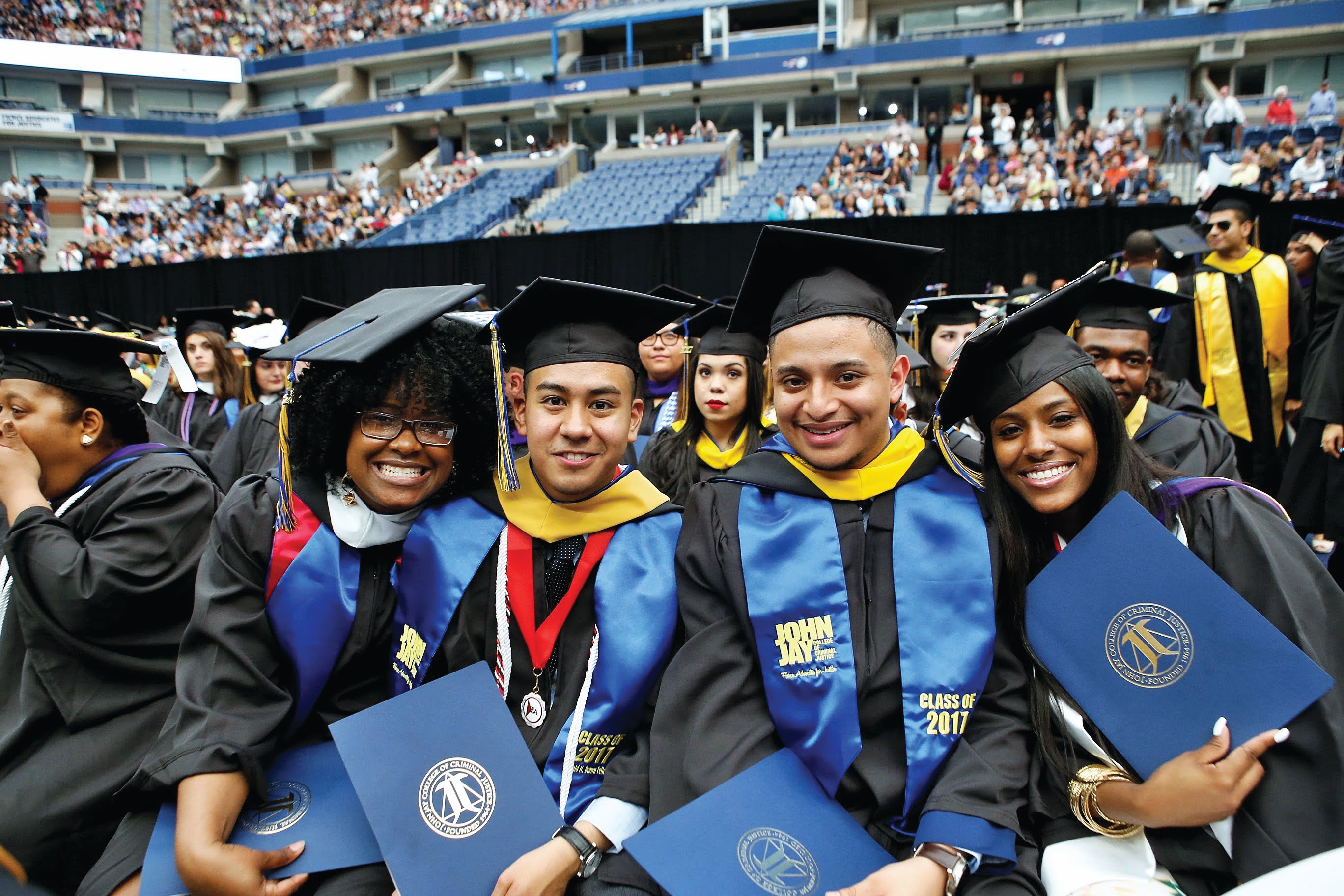 four students at commencement