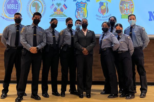 Gianni Gallimore (fourth from right) and NYPD cadets with former NYPD Commissioner Keechant Sewell 