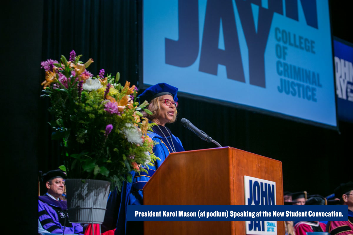 President Karol Mason (at podium) Speaking at the New Student Convocation