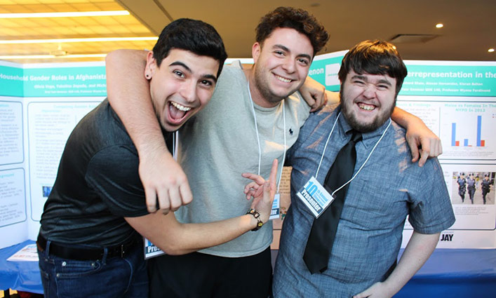 Three John Jay freshmen students at the 10th Annual First Year Student Showcase