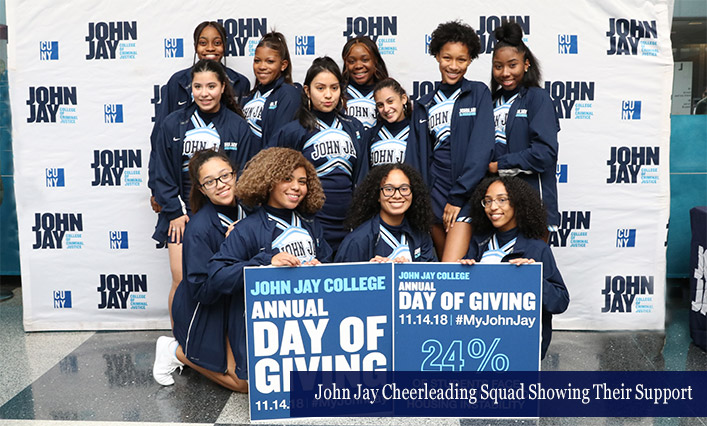 John Jay Cheerleading Squad Showing Their Support at the Annual Day of Giving