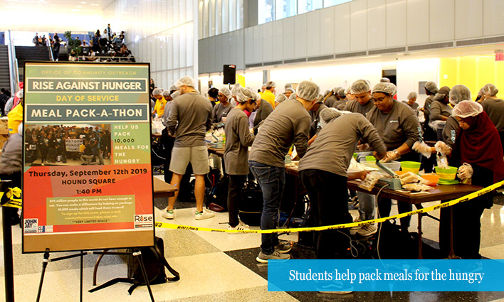 Students help pack meals for the hungry