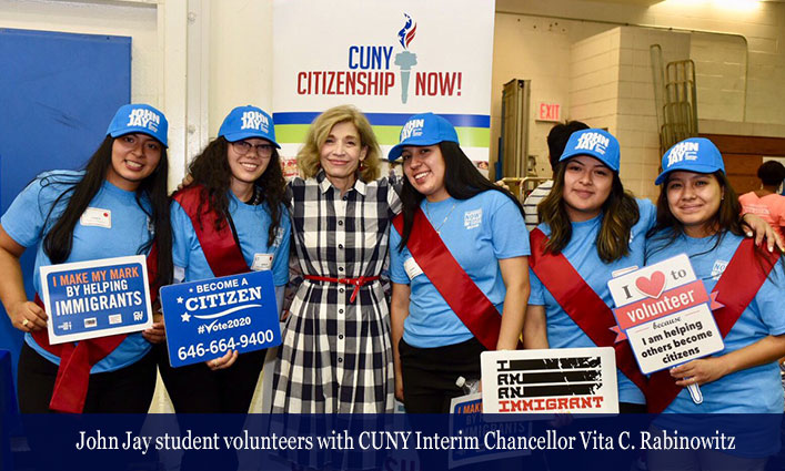 John Jay student volunteers with CUNY Interim Chancellor Vita C. Rabinowitz