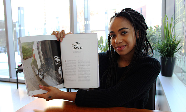 John Jay Student Miranda Barnes holding her published work