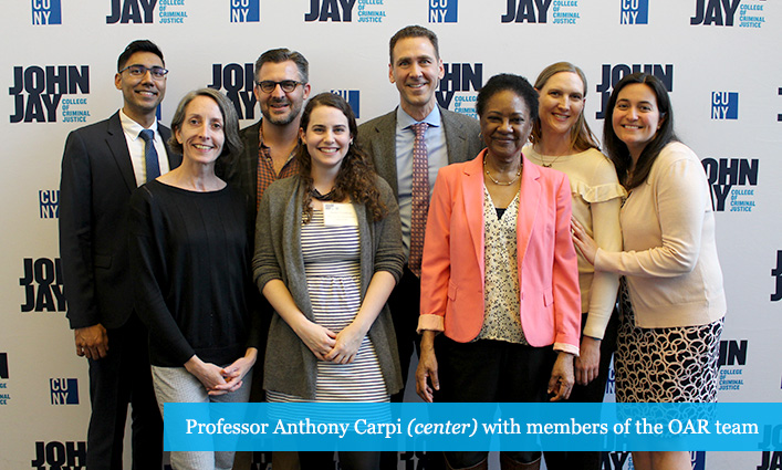 Professor Anthony Carpi (center) with members of the OAR team 