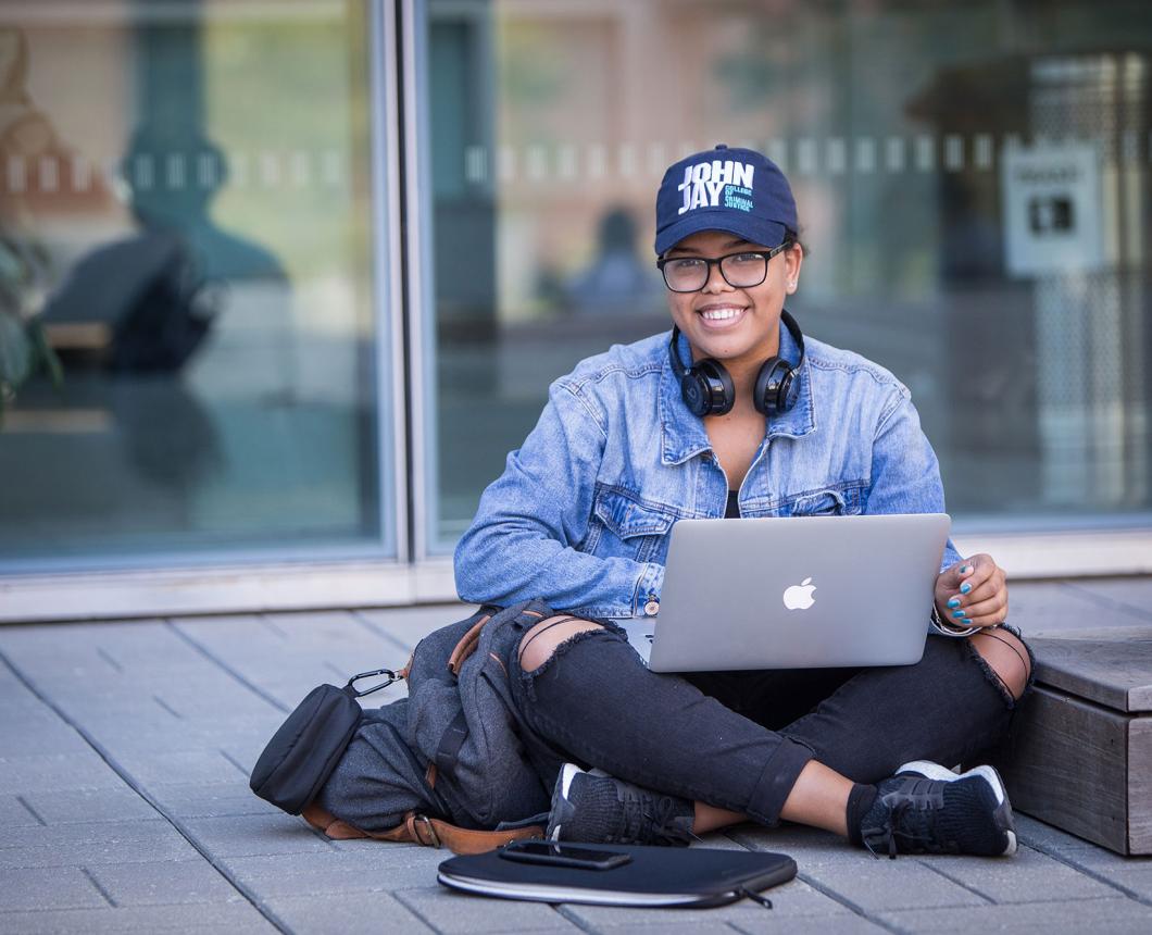 student in JJ cap