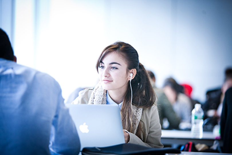 Student working at a laptop