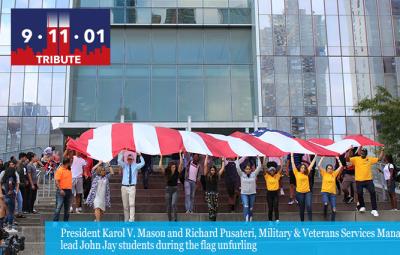 President Karol V. Mason and Richard Pusateri, Military & Veterans Services Manager, lead John Jay students during the flag unfurling