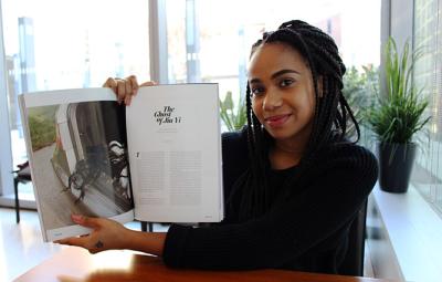 John Jay Student Miranda Barnes holding her published work